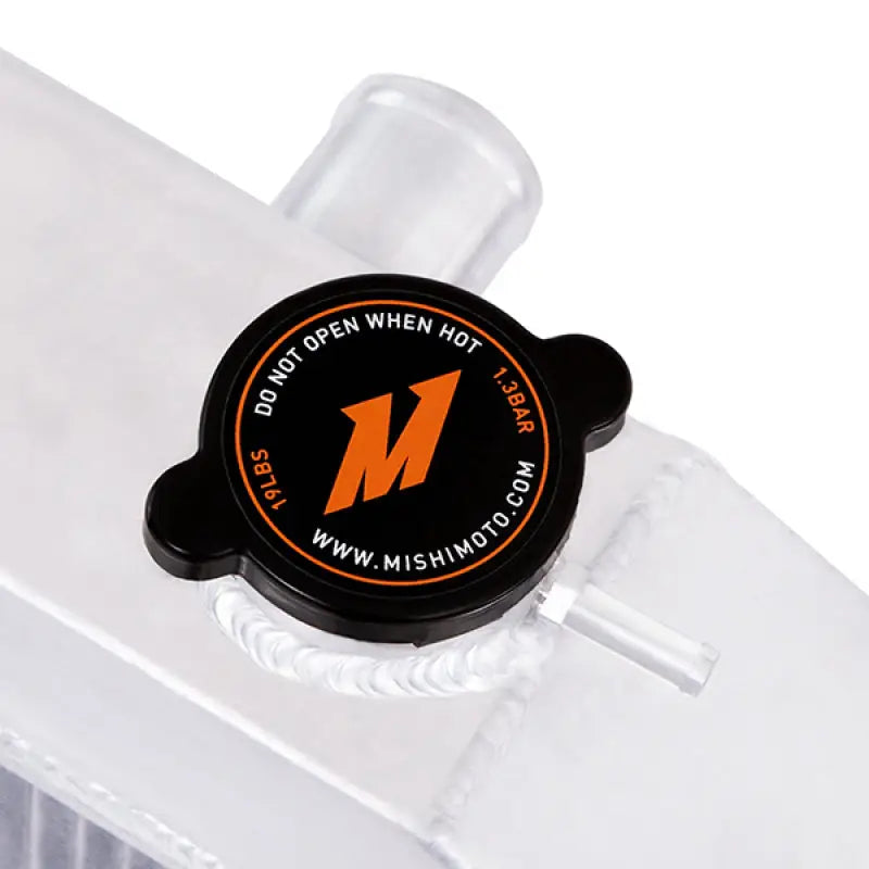 Black radiator cap on Mishimoto Ford F-Series X-Line aluminum radiator for easy cooling