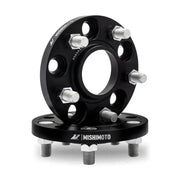 Black Mishimoto 5x114.3 15mm wheel spacers with bolts for better fitment