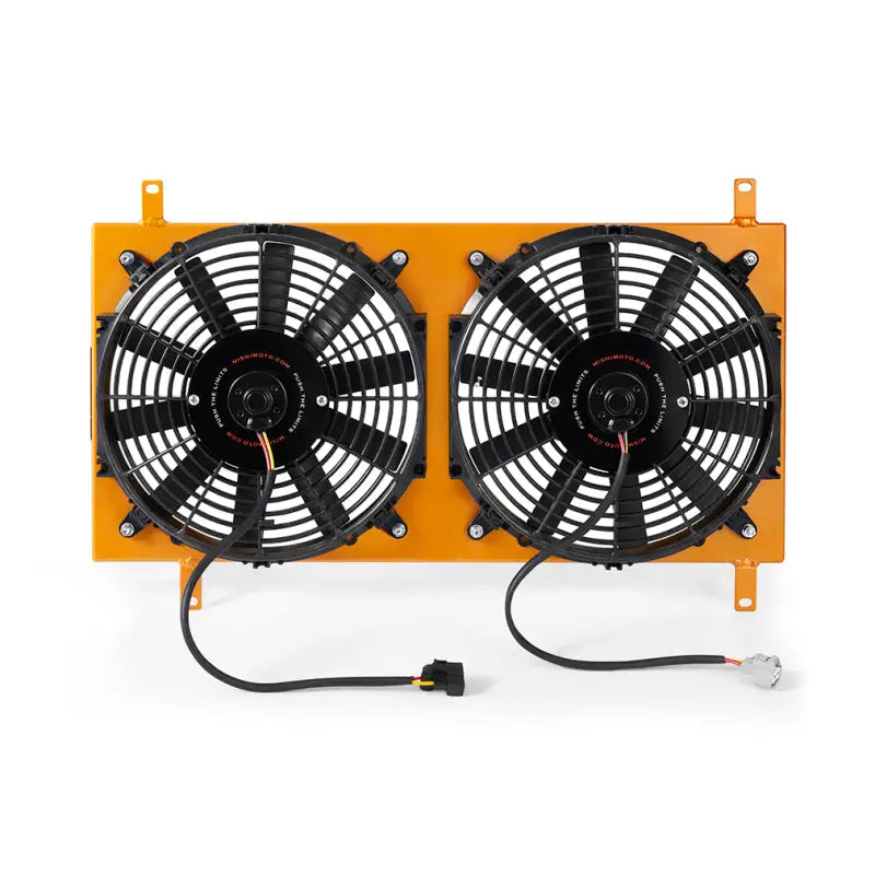 Dual electric cooling fans with orange frame in Mishimoto Mazda Miata aluminum fan shroud