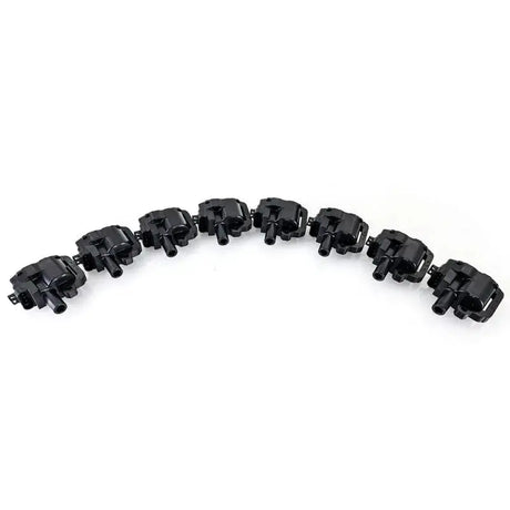 Eight black ignition coils in Mishimoto GM LS1 ignition coil set for engine upgrade