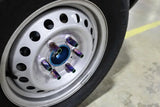 Iridescent locking lug nuts on car wheel for Mishimoto Aluminum Locking Lug Nuts M12x1.5