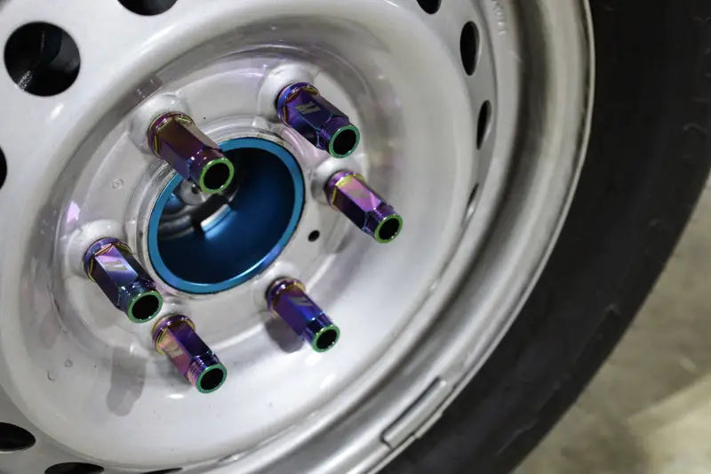 Car wheel with iridescent locking lug nuts from Mishimoto Aluminum Locking Lug Nuts set