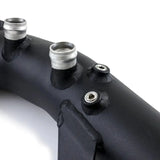 Black metal charge pipe with silver fittings for Mishimoto BMW N54 engine buildup