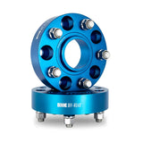 Blue Mishimoto Borne Off-Road Wheel Spacers with bolts for improved fitment