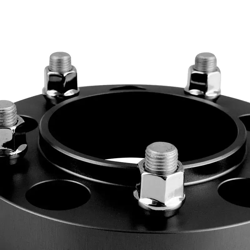 Black Mishimoto Borne Off-Road Wheel Spacers with silver studs for improved fitment
