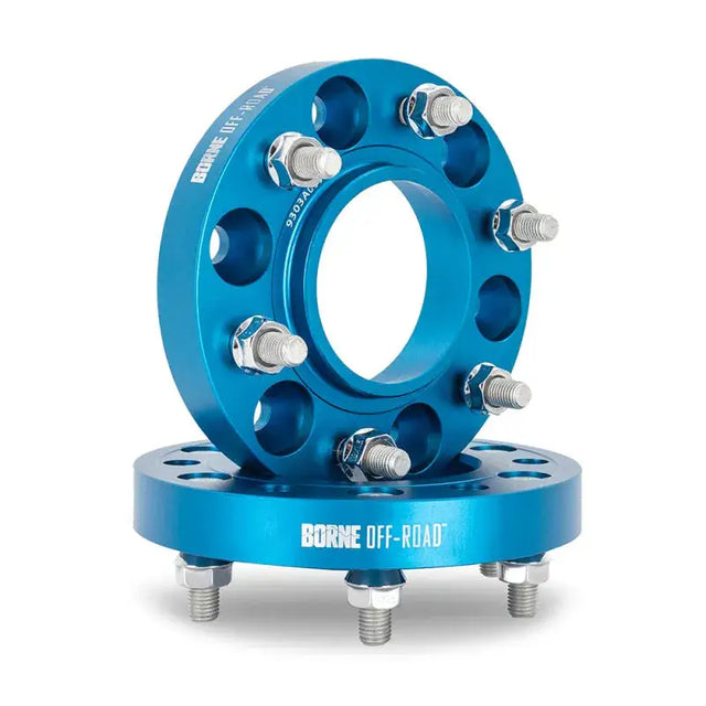 Blue Mishimoto Borne wheel spacers with bolts for 5x150 setups
