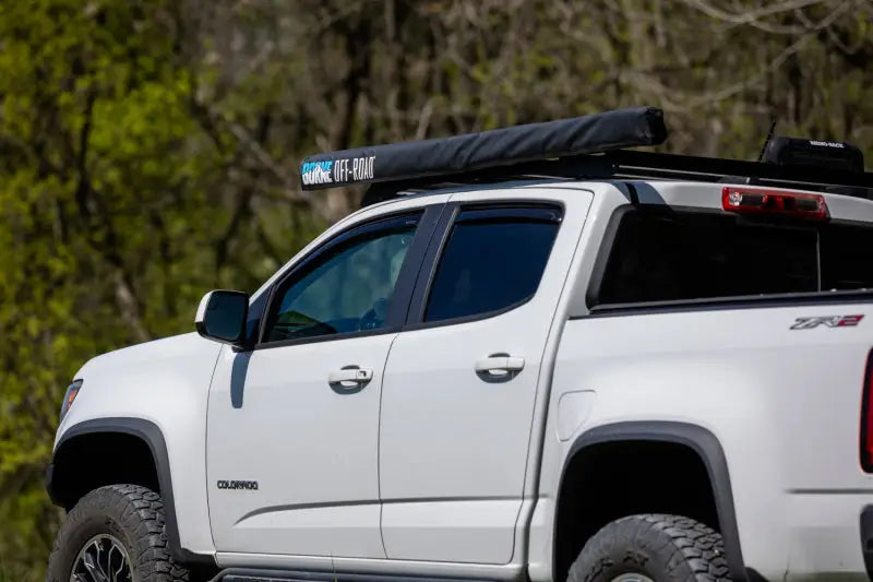 White pickup truck with Mishimoto Borne Rooftop Awning 93in L x 118in D Grey