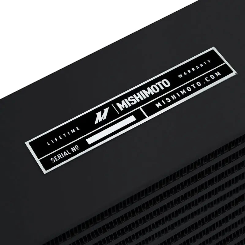 Black Mishimoto heavy-duty oil cooler with 17-inch outlets for enhanced cooling performance