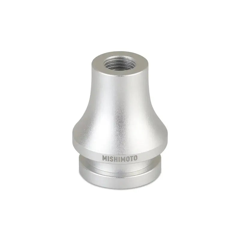 Silver-colored Mishimoto shift boot retainer adapter for secure shift boot installation