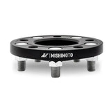 Black wheel spacer with studs from Mishimoto Tesla Wheel Spacer Staggered Bundle 15mm 20mm