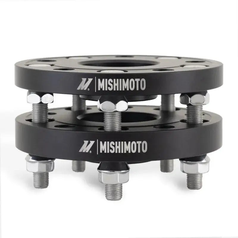 Black wheel spacers with bolts from Mishimoto Tesla Wheel Spacer Staggered Bundle 15mm + 20mm