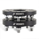Black wheel spacers with bolts from Mishimoto Tesla Wheel Spacer Staggered Bundle 15mm + 20mm