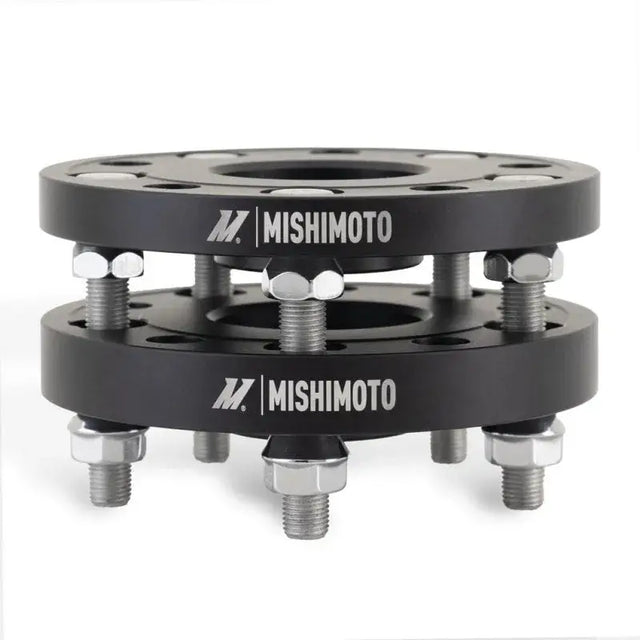 Black wheel spacers with bolts from Mishimoto Tesla Wheel Spacer Staggered Bundle 15mm + 20mm