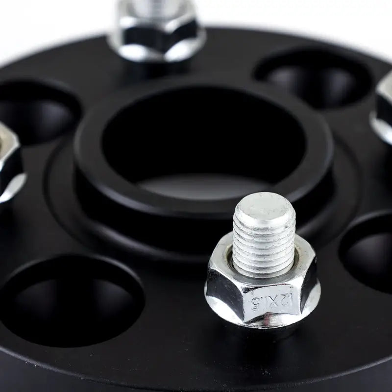 Black Mishimoto Wheel Spacers with silver studs for 4x100 wheels