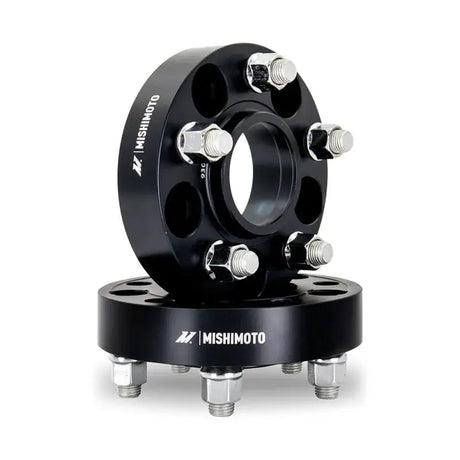 Black Mishimoto wheel spacers with studs for 5x114.3 bolt pattern and 25mm width