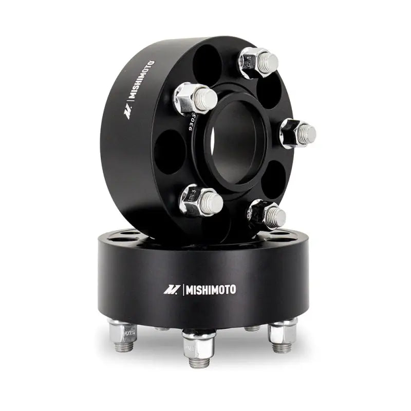 Black Mishimoto Wheel Spacers with silver studs for improved fitment and style