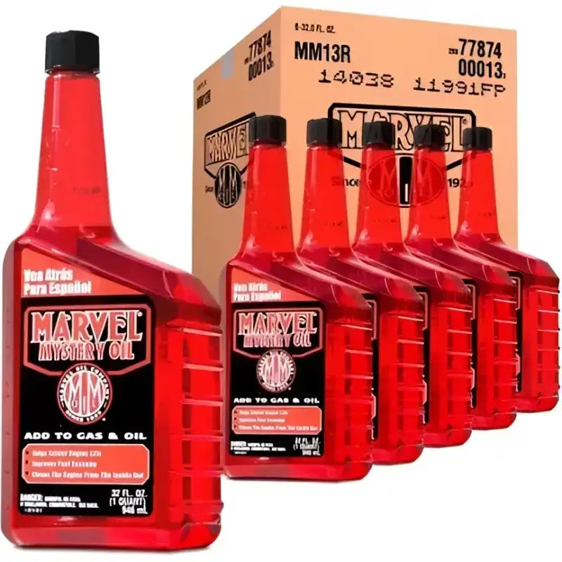 Six bottles of MM13R Turtlewax Marvel Mystery Oil 32.0 F with box in background.