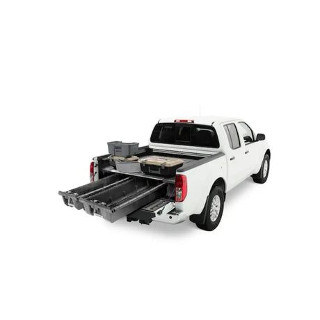 White Nissan Frontier pickup truck with MN4 Decked bed storage system for easy access