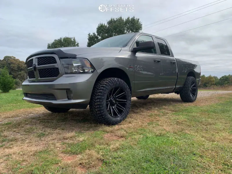 Gray lifted Ram truck with Wheel Pros MO998 20-inch Mo998 wheels and all-terrain tires