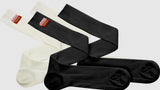 Black and white knee-high Momo Comfort Tech Socks for ultimate comfort and style