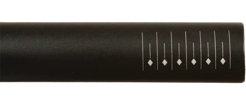Dark gray cylindrical handlebar with measurement marks for level riding clinics