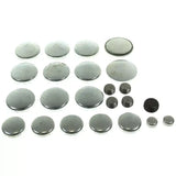 Assorted metal freeze plugs from MPE-113R Melling Freeze Plug Kits Bagged