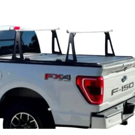 White pickup truck with black bed rack.