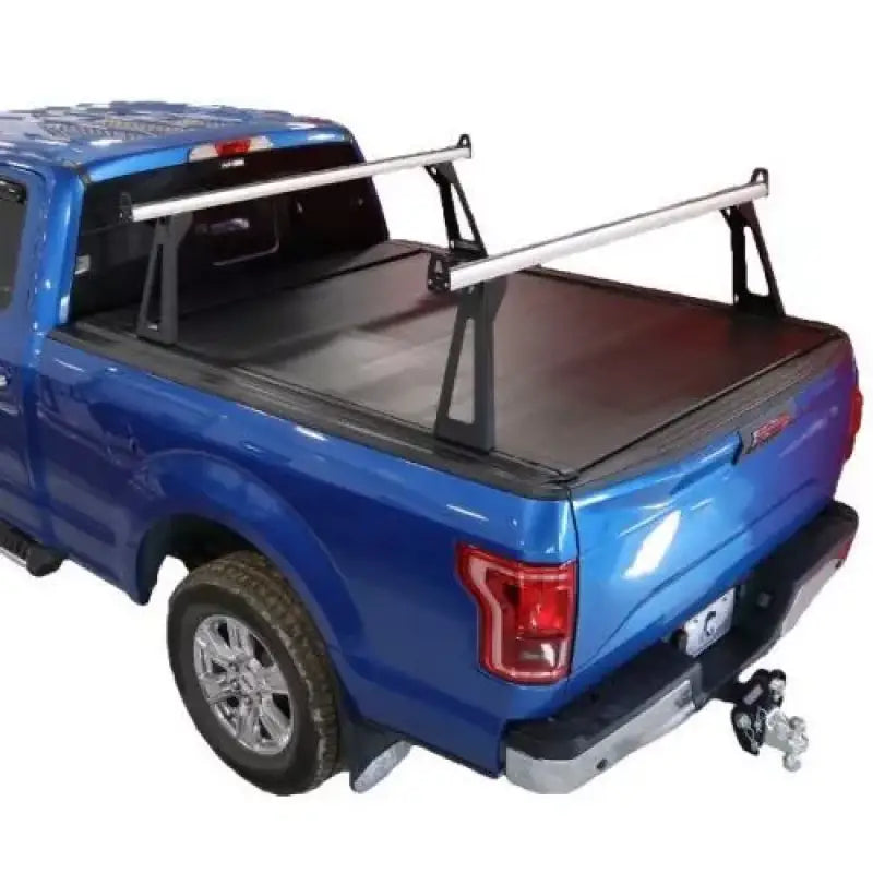 Blue pickup truck with bed rack.