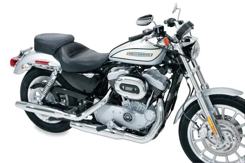 Silver and black Harley-Davidson motorcycle with Mustang 04-21 Harley Sportster touring solo seat