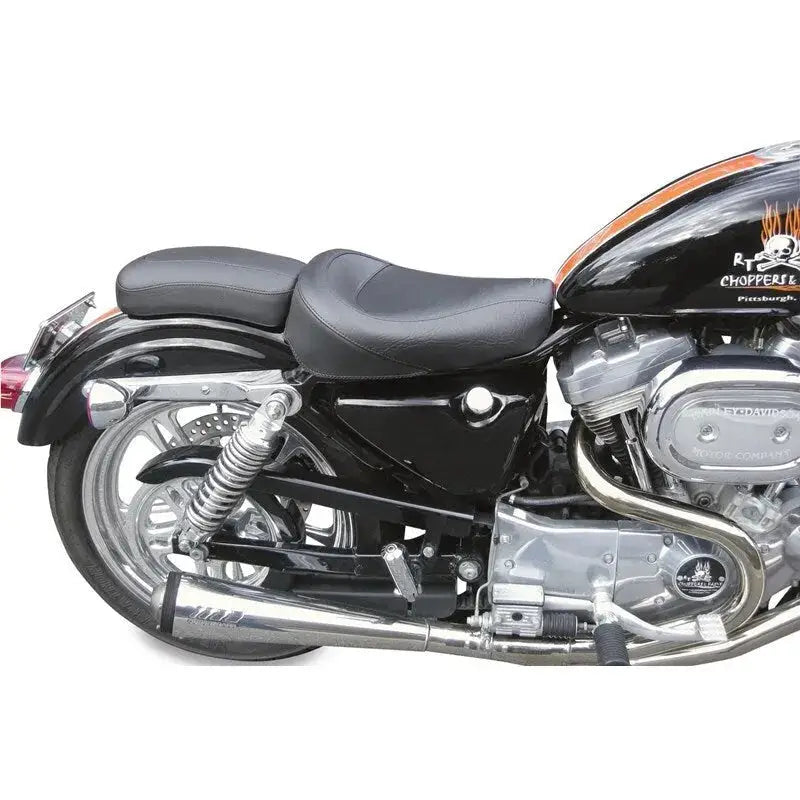Black Harley Dyna motorcycle with chrome accents on Mustang 06-17 standard touring solo seat