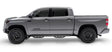 Gray Toyota Tundra with matte black stainless steel nerf bar and drop down steps
