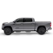 Gray Toyota Tundra with matte black stainless steel nerf bar and drop down steps