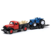 Red truck hauling blue tractor from New Ray Toys 1946 Dodge Power Wagon scale