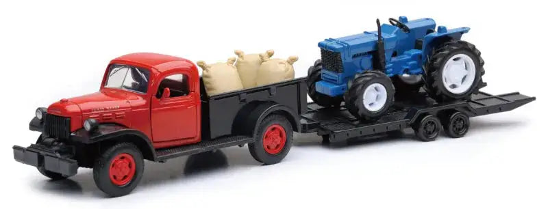 Red truck hauling blue tractor from New Ray Toys 1946 Dodge Power Wagon scale