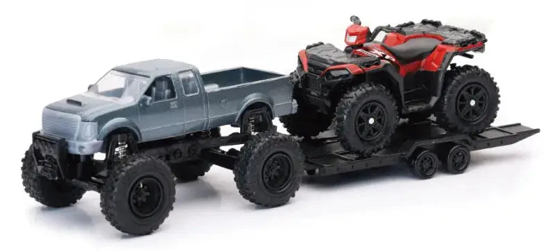 Toy truck hauling ATV on trailer with Polaris Sportsman XP1000 offroad pickup display