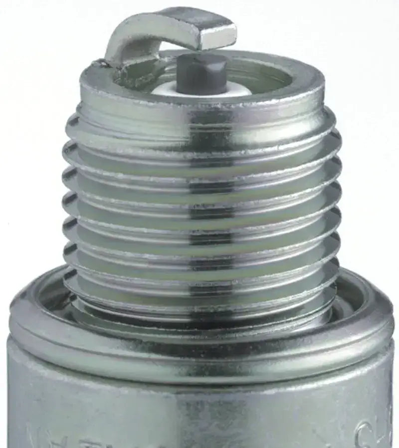 Shiny metal NGK Standard Spark Plug in a spark plug box for BR8HS engines