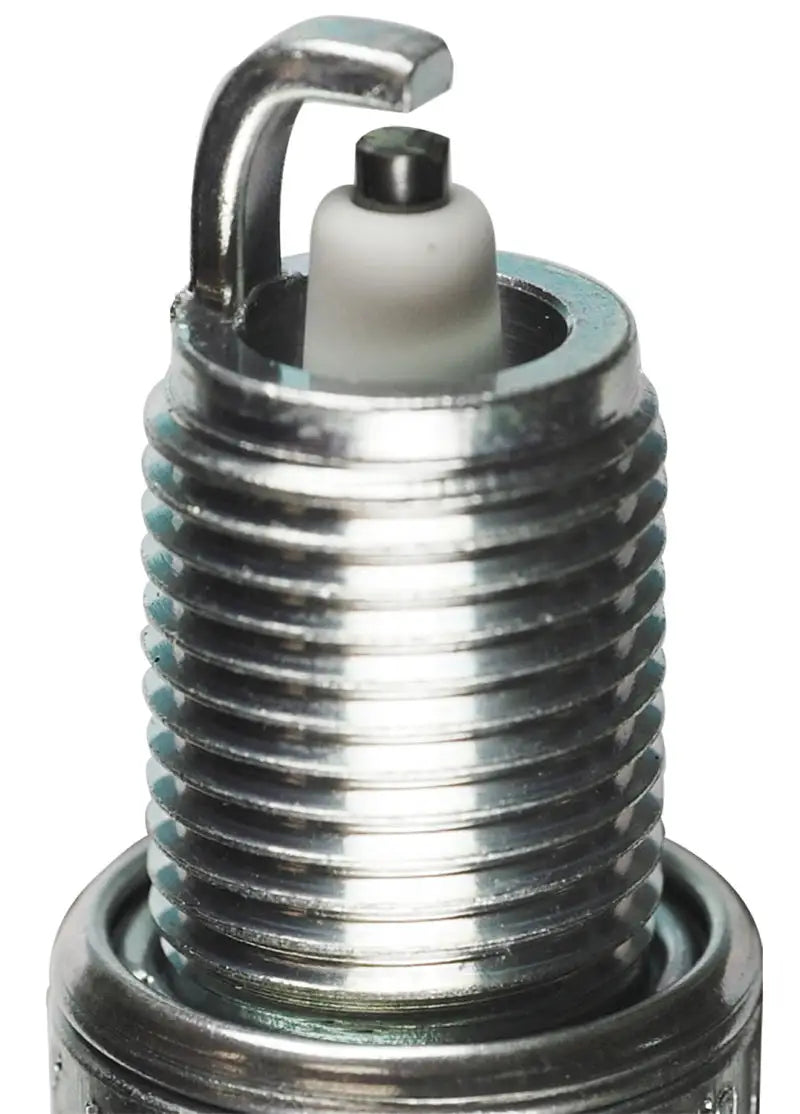 Shiny metal spark plug in NGK V-Power spark plug box of 4, perfect for car repairs