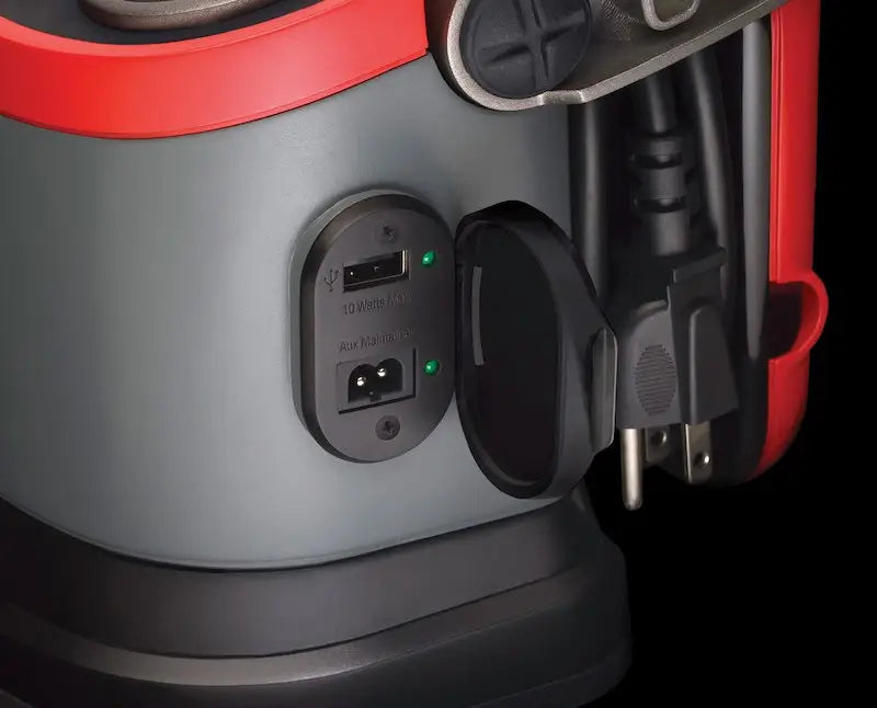Red and gray Optima Bat portable power station with USB, AC outlets, green lights for truck accessories