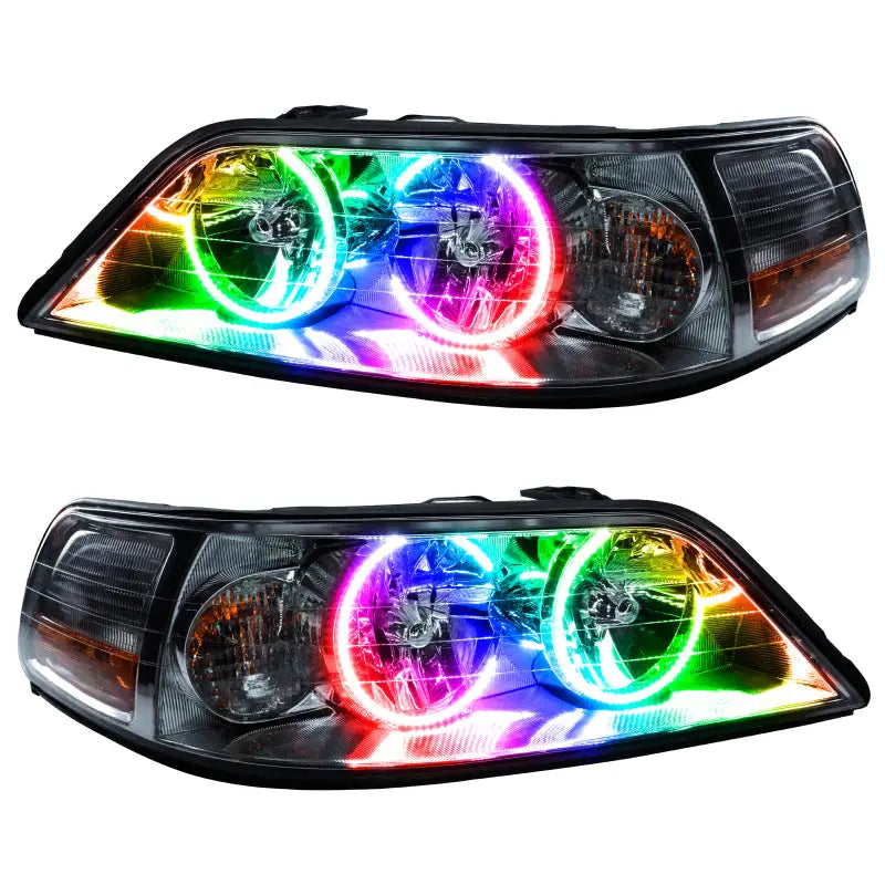 Pair of aftermarket Lincoln Town Car headlights with colorful halo rings and ColorSHIFT LEDs