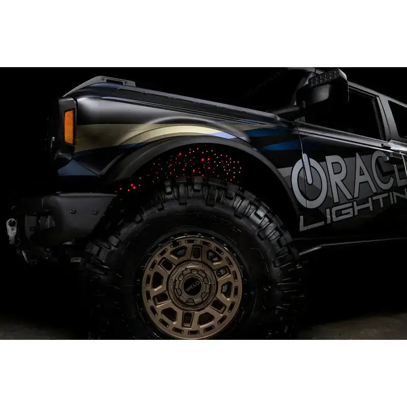 Black Ford Bronco with custom lighting featuring Oracle Lighting Fiber optic wheel liners