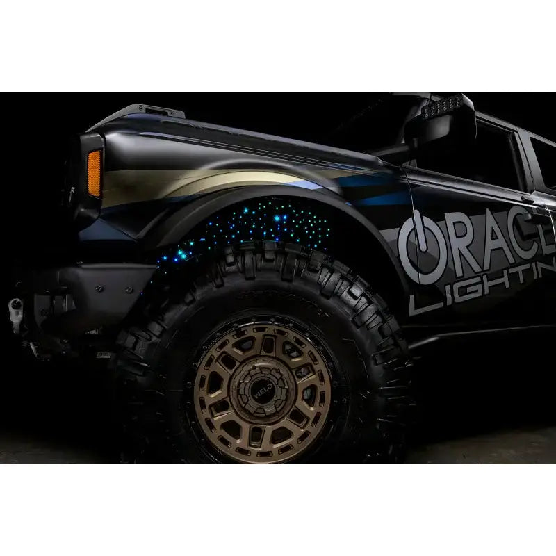 Black Ford Bronco with custom lighting fiber optic wheel showing Oracle Lighting Fiber optic kit