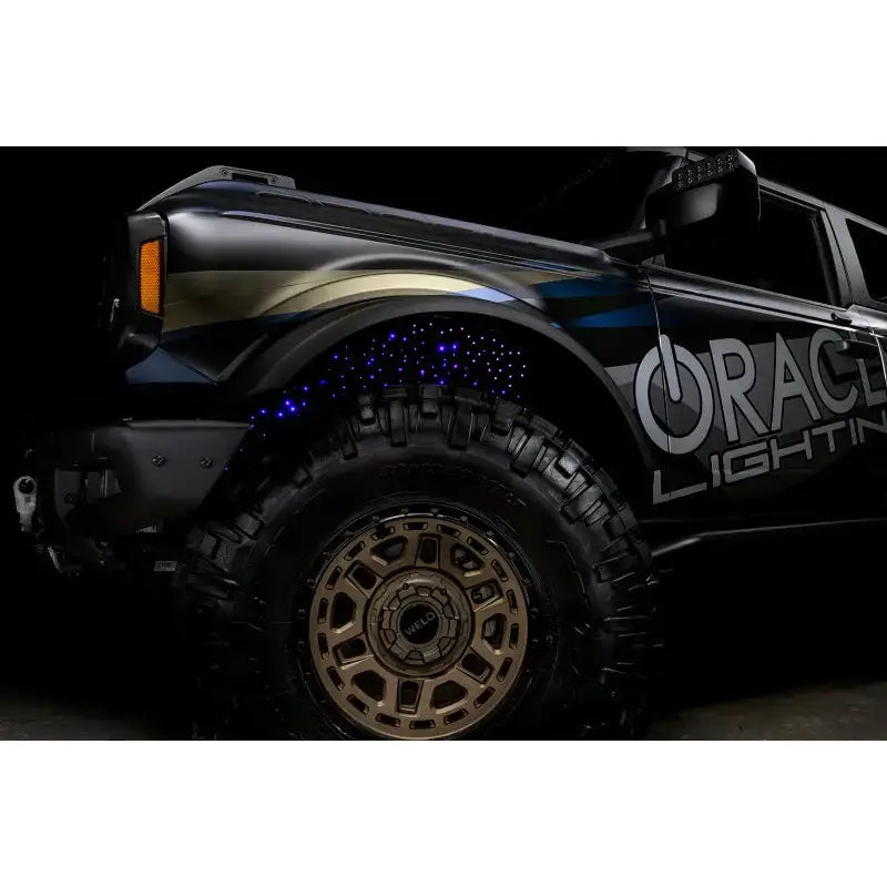 Black Ford Bronco with custom lighting featuring Oracle Lighting Fiber Optic Wheel and ColorSHIFT RGBW Kit