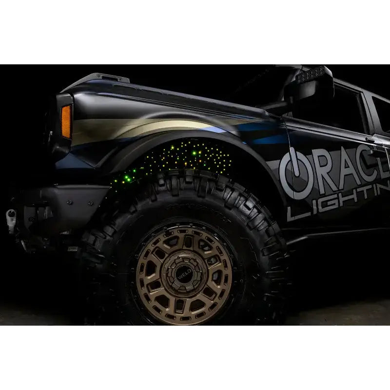 Illuminated off-road vehicle with Oracle Lighting Fiber Optic Wheel featuring RGBW lighting fiber optic system