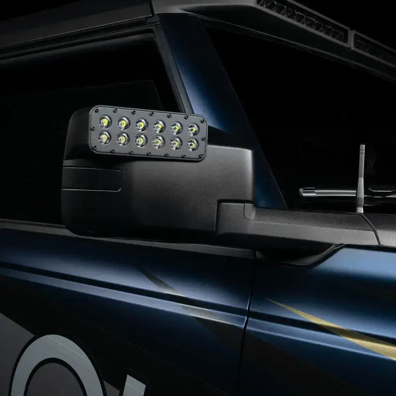 Black truck side mirror with Oracle Magnetic Light bar cover and LED light bar setup