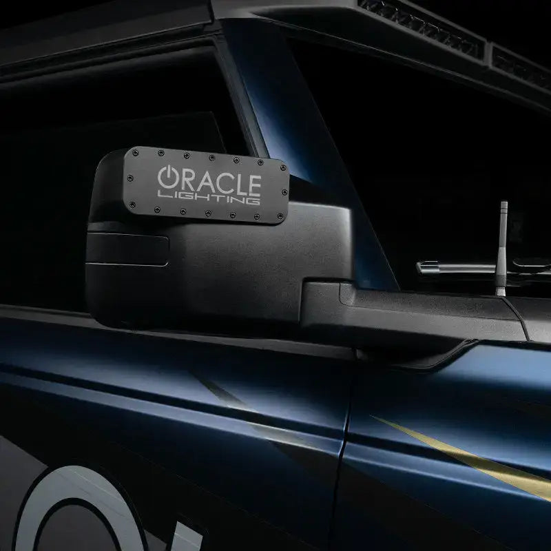 Black side mirror with lighting featuring Oracle Magnetic Light bar Cover for LED side mirrors