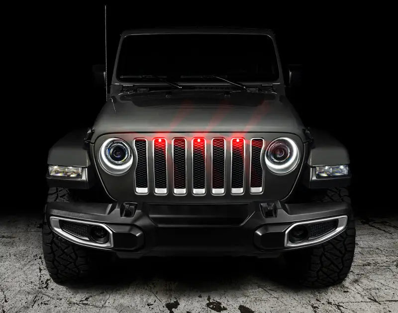 Gray Jeep Wrangler with illuminated style LED grille in the Oracle Pre-Runner LED Grille Kit