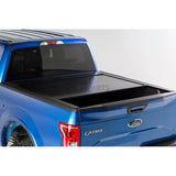 Blue Ford F-150 with black tonneau cover and Pace Edwards Bedlocker Rails BL5161