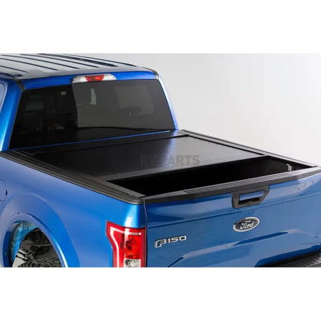 Blue Ford F-150 with black tonneau cover and Pace Edwards Bedlocker Rails BL5161