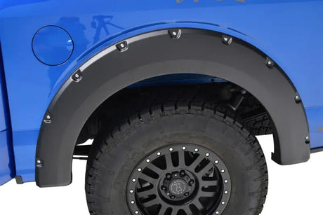 Blue truck with black textured TrailFX fender flares set of 4 for style and protection