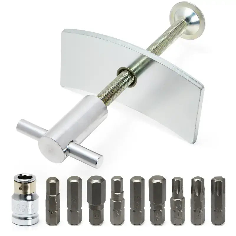 Silver brake caliper compression tool with assorted bits for disc brake pad installation